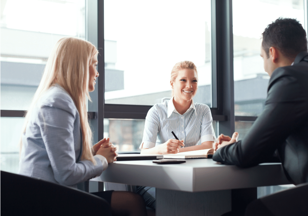 Risk consultant reviewing documents with clients